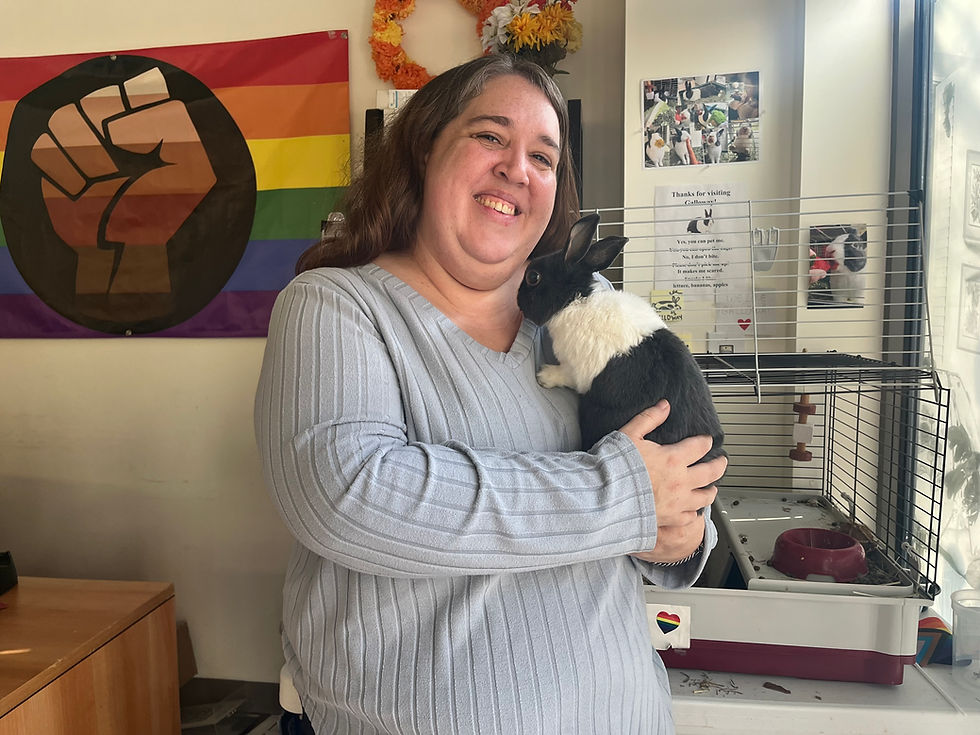 Lizz Elvira with their rabbit Galloway in the Multicultural Center. (Photo by Xiaoying Wu Hong)