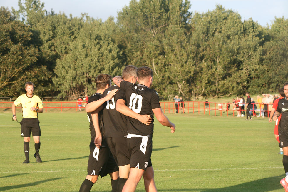 Jay Yule and Nick Mann congratulate Jamie Hume on his opener.
