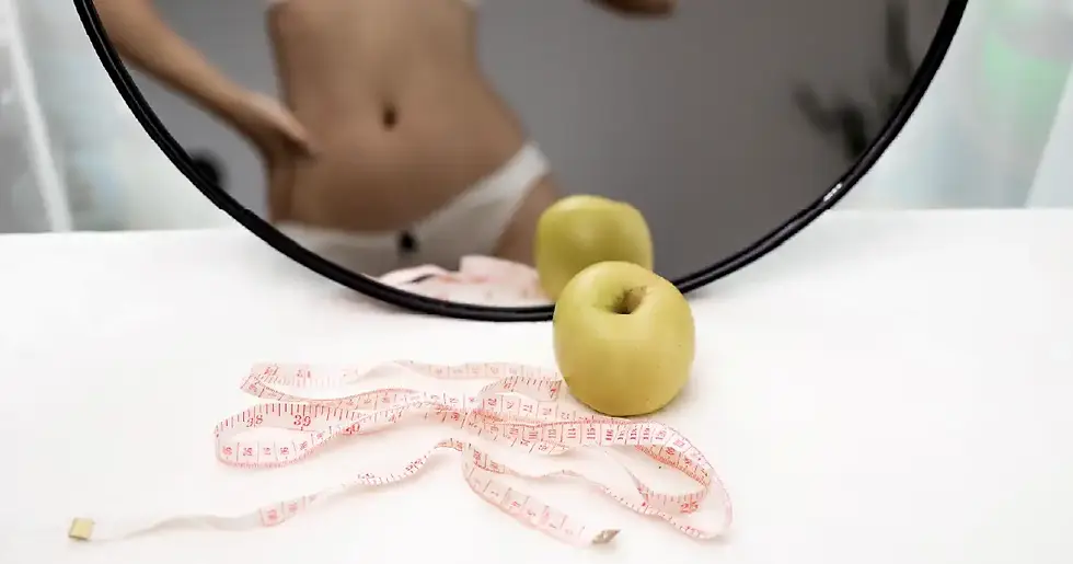 Apple and measuring tape symbolizing healthy lifestyle and Semaglutide for Weight Loss results reflected in the mirror.