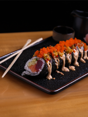 Delicious sushi rolls, including the signature Absaroka Roll and spicy tuna roll.