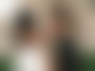 A groom admiring his bride in front of the Kansas state capitol building photographed by a kansas city wedding photographer