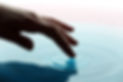 Hand Touching Water