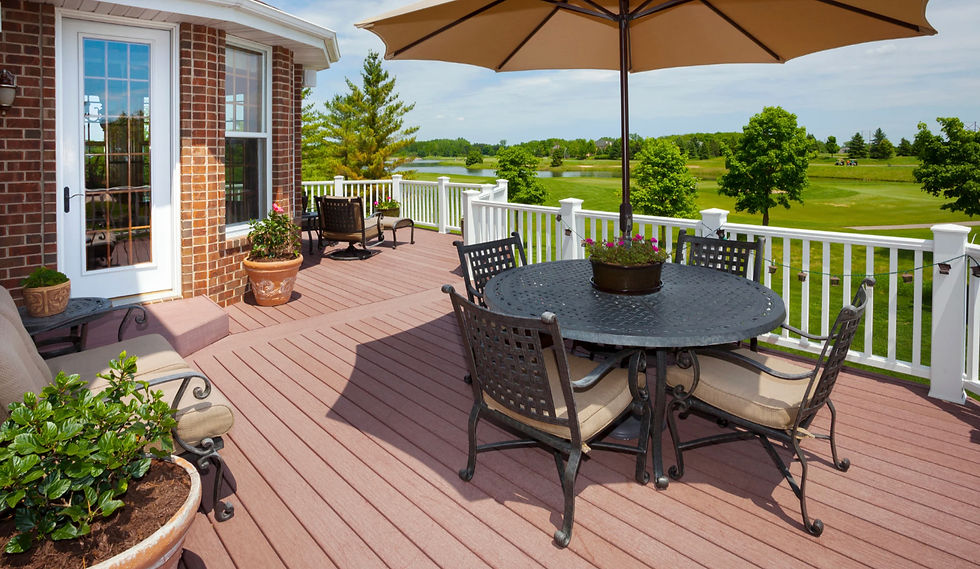 New deck construction featuring a large composite deck and white railing, ideal for home exterior re