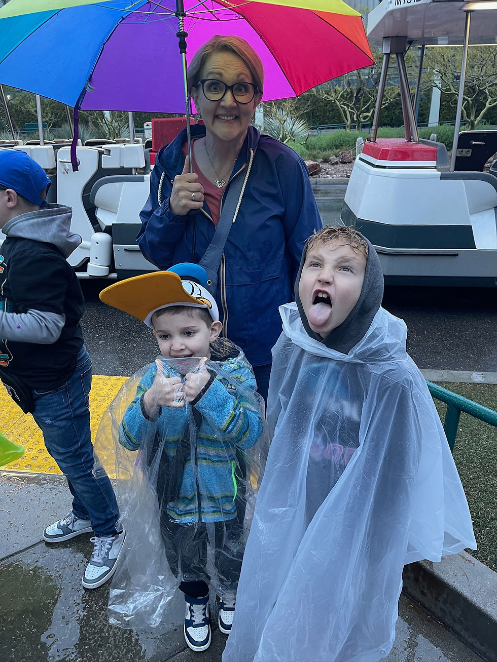 Kids at Disneyland in the rain