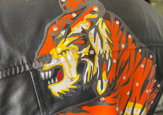 Tiger painted on the back of a leather jacket