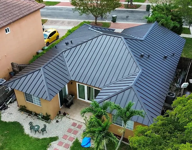 A sleek standing seam metal roof installation providing durability and modern design, ideal for Miami’s weather conditions