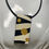 Thumbnail: Black/Gold Retro Polymer Clay Necklace + Matching Earrings Set
