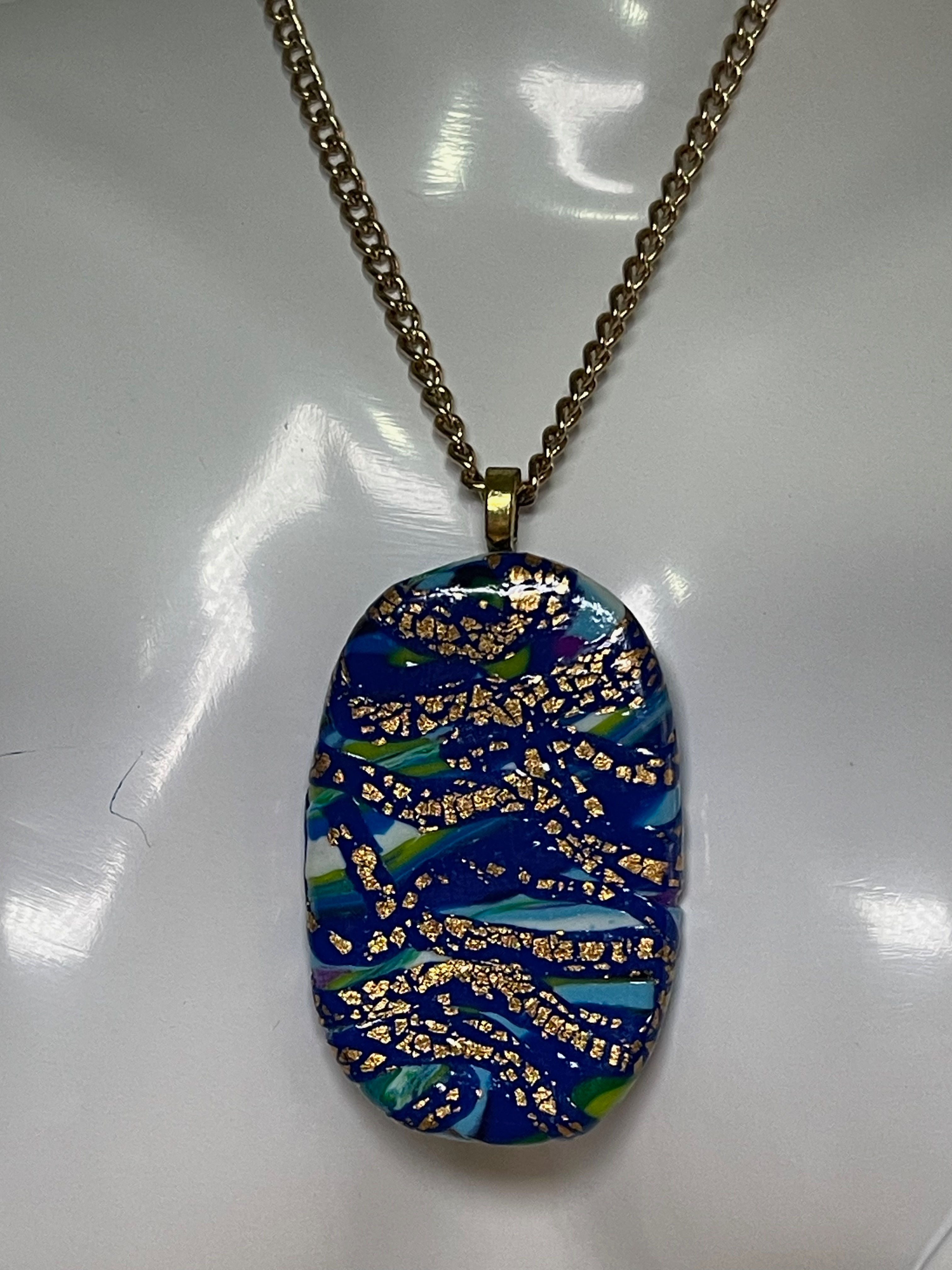Distressed Gold On A Cobalt base Pendant On a Chain