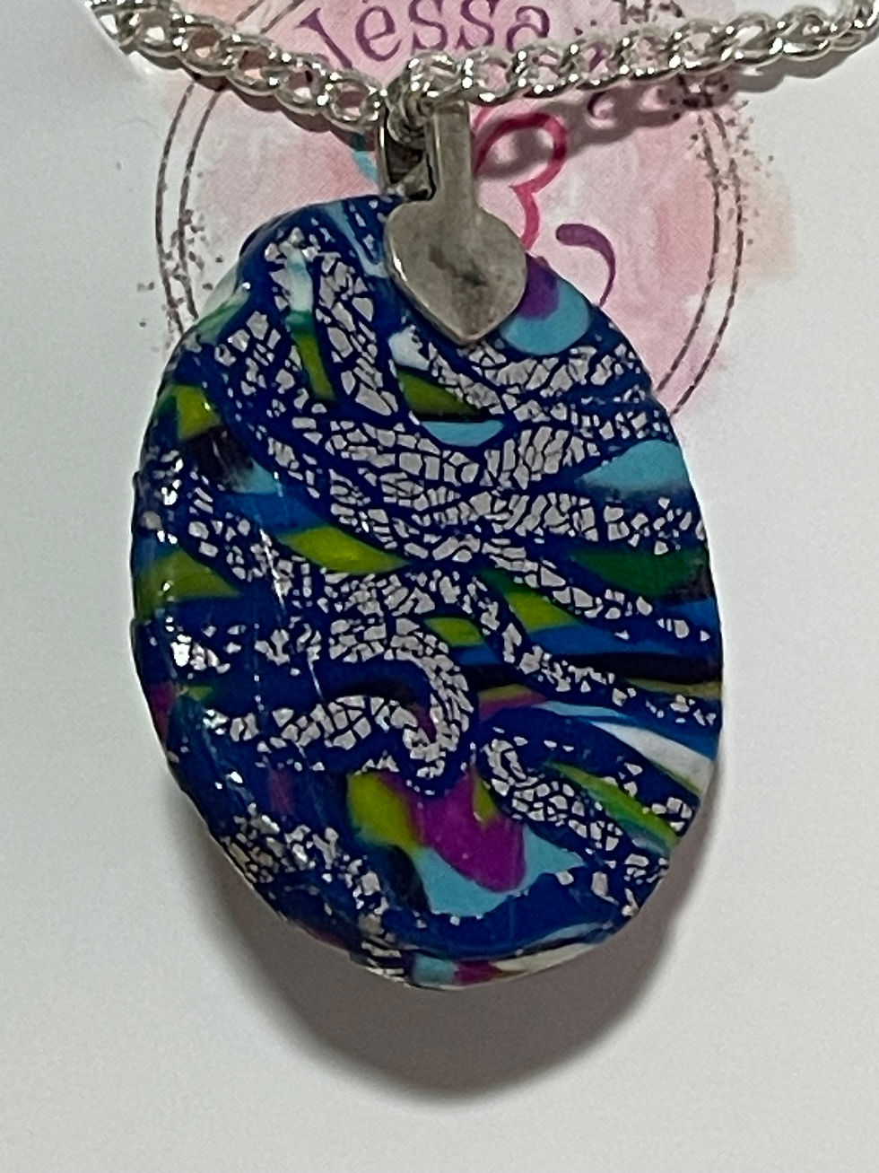 Thumbnail: Distressed Silver On A Cobalt Base Pendant On a Chain