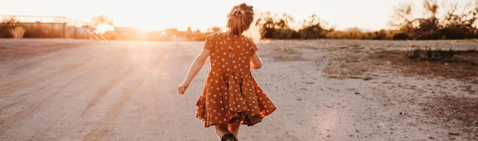little cowgirl dancing into the sunset