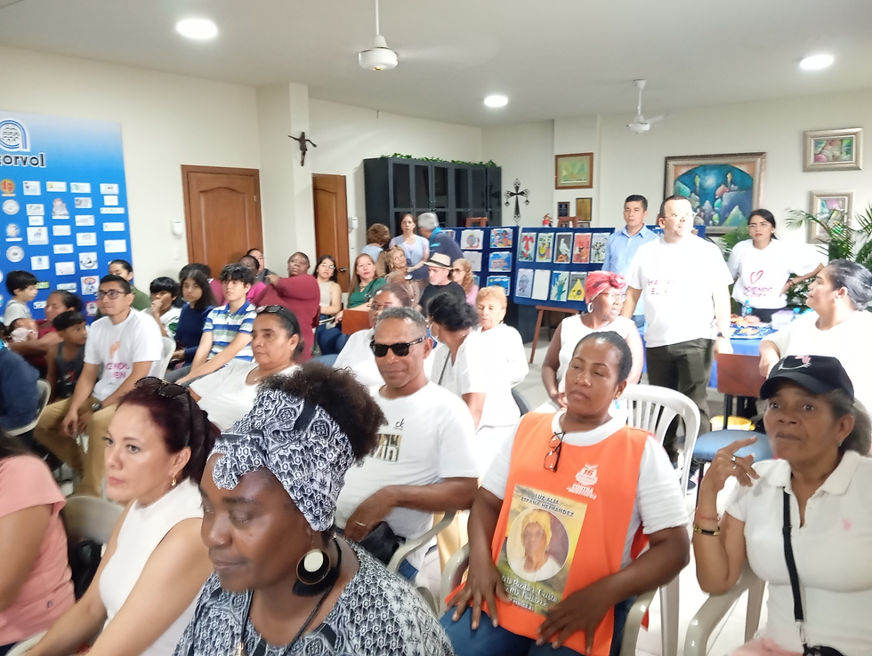 Audience during the Good Deeds Day Festival in Guayaquil, with peace-themed artworks on display