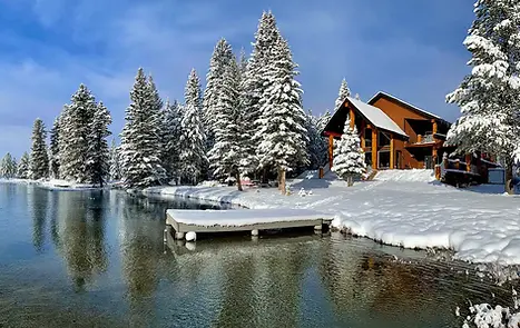 Rustic Mountain cabin on the water in winter