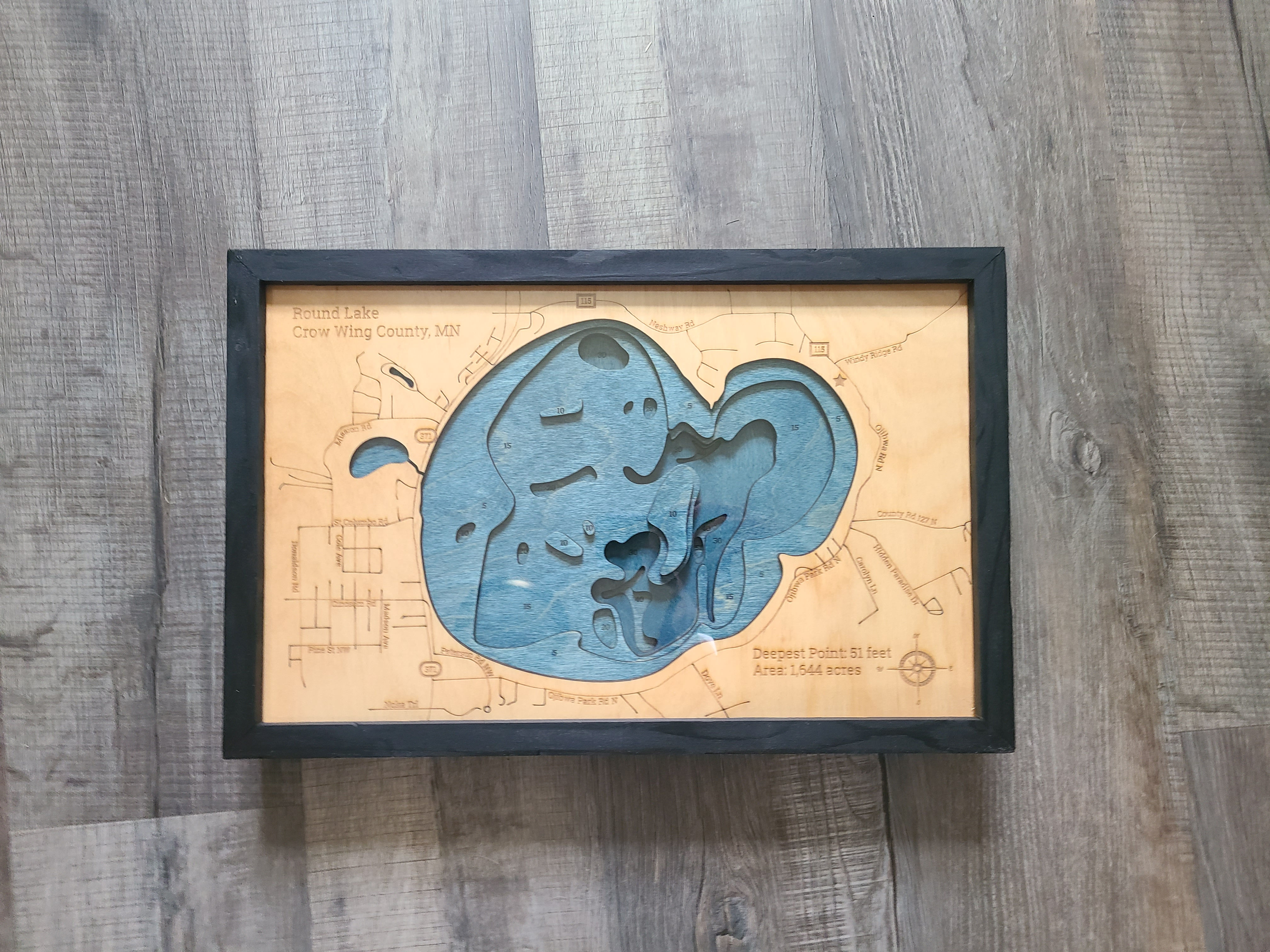 Round lake 3d wood map in black frame