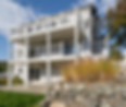 Multi-level composite deck with cable railings designed for outdoor entertaining in Maine