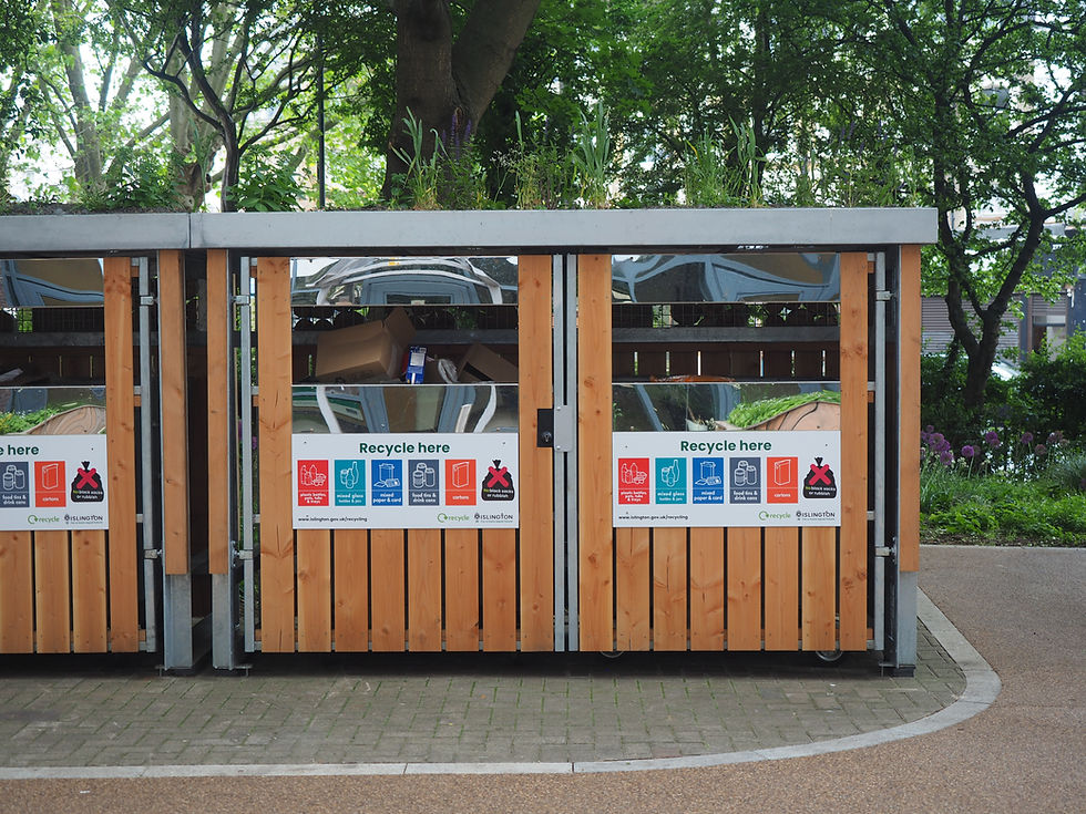 Our green roof bin shelters with information on what to recycle.
