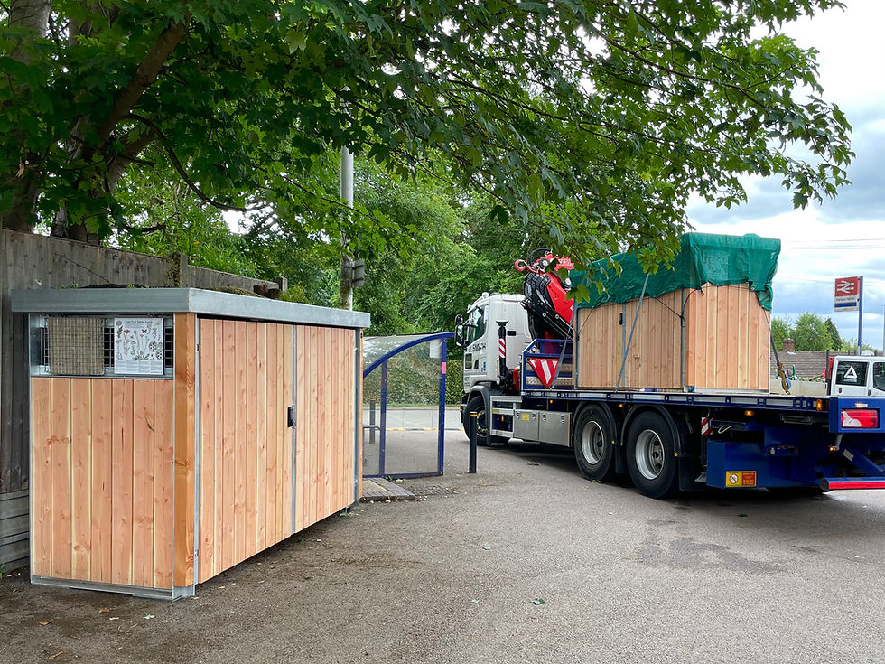 A lorry delivering our bin shelter ready to use. Our shelters offer a planting and wildlife richness as well as an aethetic beauty (compared to the boring plastic shelter it replaces).
