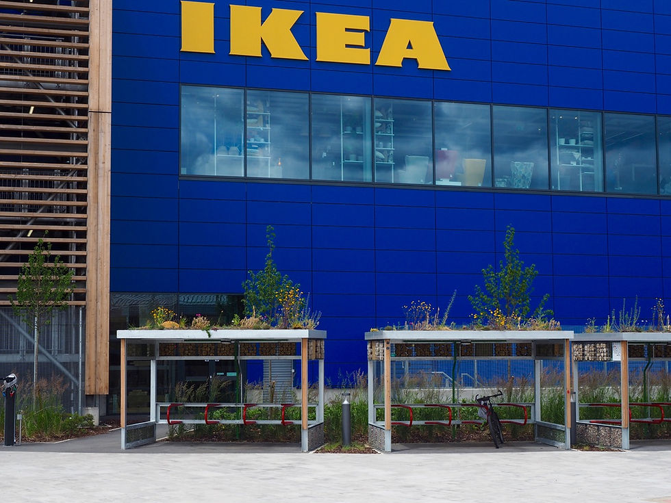 Ikea logo above green roof shelters cycle stores.