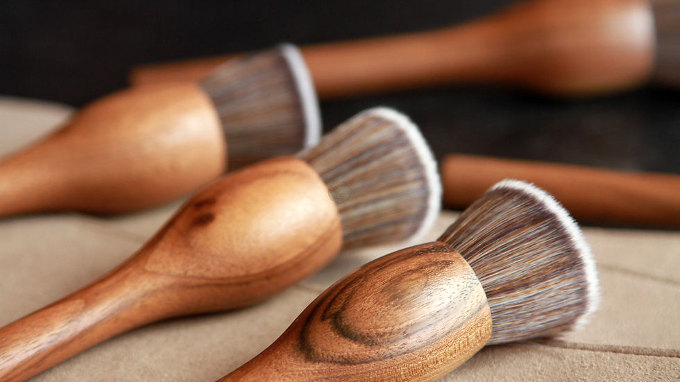 Close-up view of the Black Walnut Foundation Brush on a wooden surface