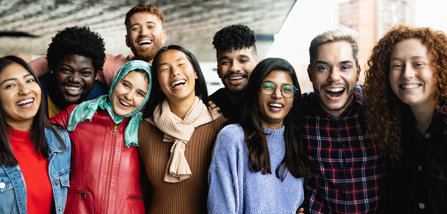 Young multi ethnic friends having fun together hanging out in the city - Friendship and di