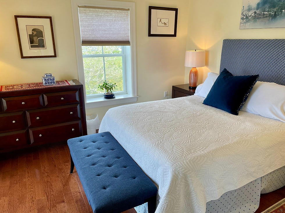 Light-filled guest room with queen bed on Cape Sable Island, Nova Scotia