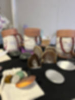 Agate crystals at the front surrounded by other crystals displayed at market