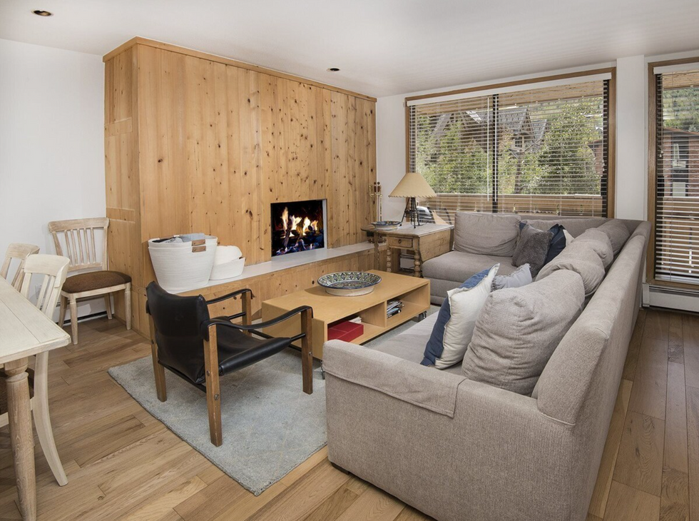 a living room with a fireplace and a couch