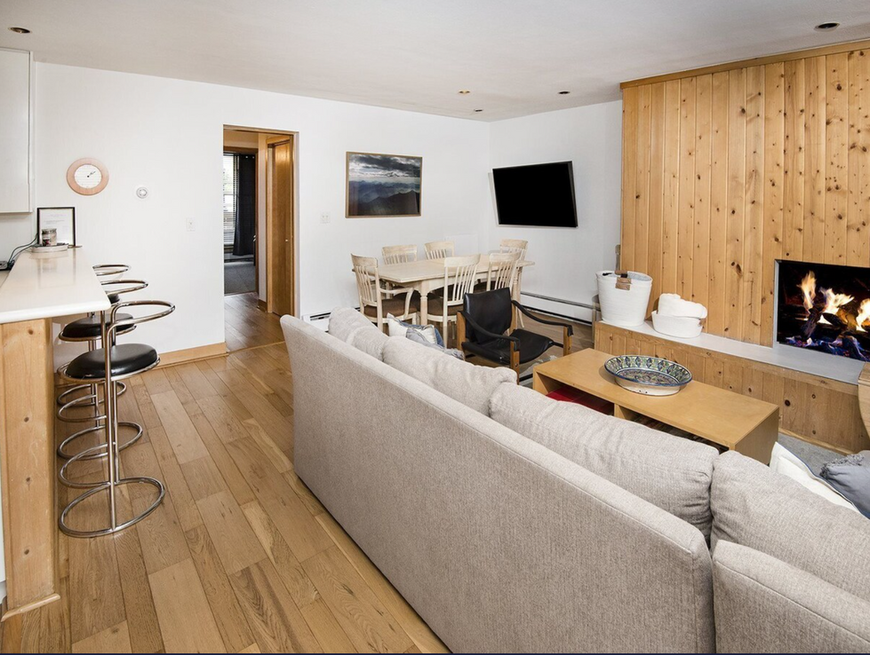 a living room with a couch and a flat screen tv