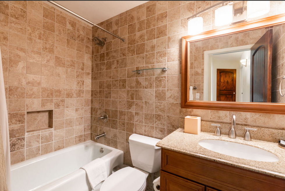a bathroom with a bathtub toilet and sink