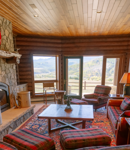 a living room filled with furniture and a fireplace