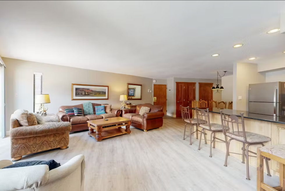 a living room with two couches and a coffee table