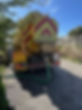 waste removal truck on country road