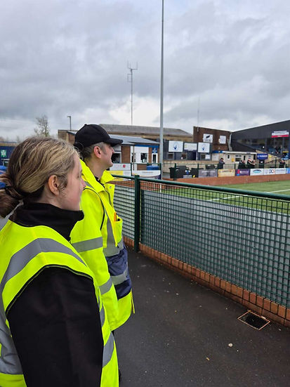 Stewards watching football match