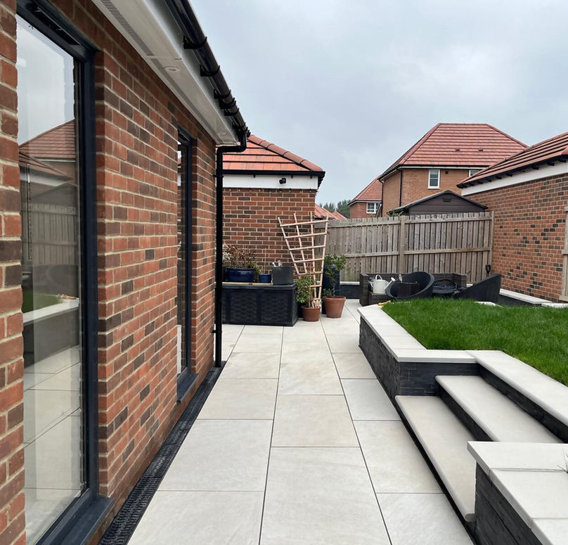 white paved patio at back of house