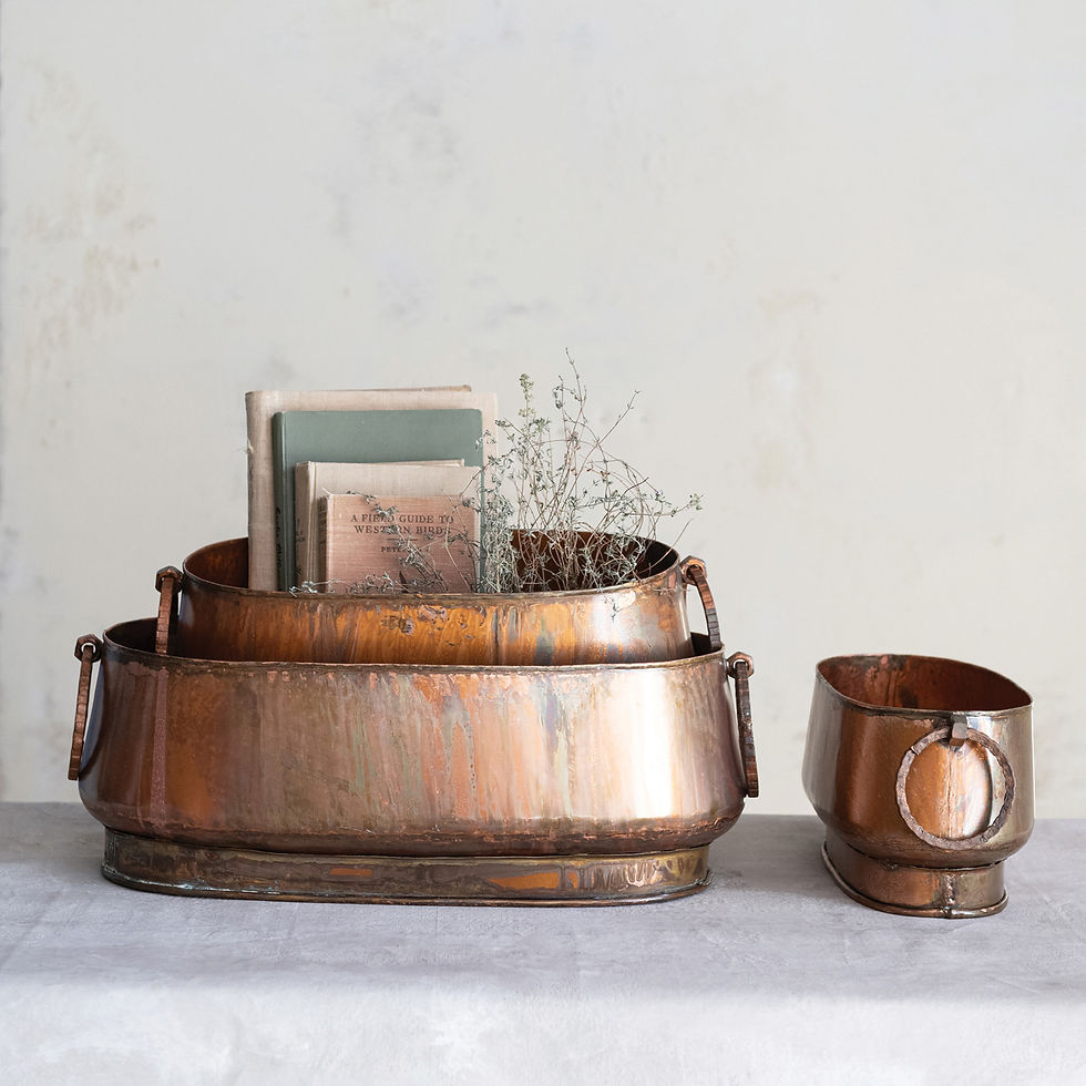 Thumbnail: The copper metal planters styled on a table, used as decorative containers for books and dried florals.