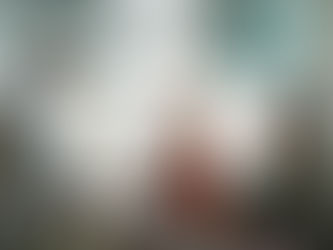 Man submits a form to a smiling election worker indoors. Background shows "Vote Day" on a booth. Mood is professional and engaging.