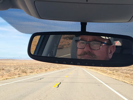face on car mirror