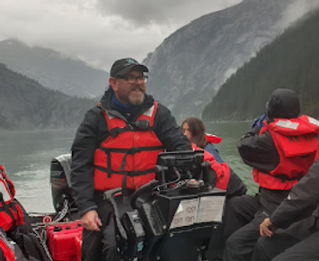 with life jacket in boate