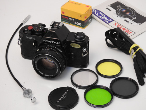 Black Pentax MX S.L.R 35mm film camera + 50mm f 2.0 lens+ New
