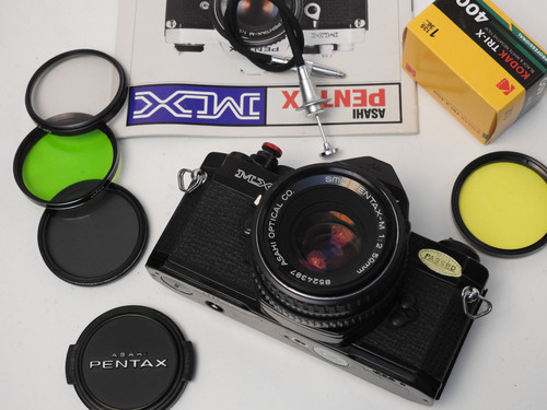 Black Pentax MX S.L.R 35mm film camera + 50mm f 2.0 lens+ New