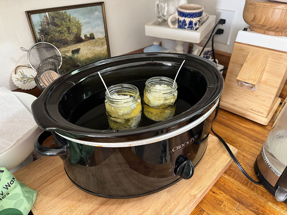 candle jars in crockpot melting wax