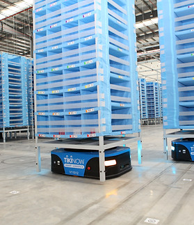 blue robot in a warehouse 