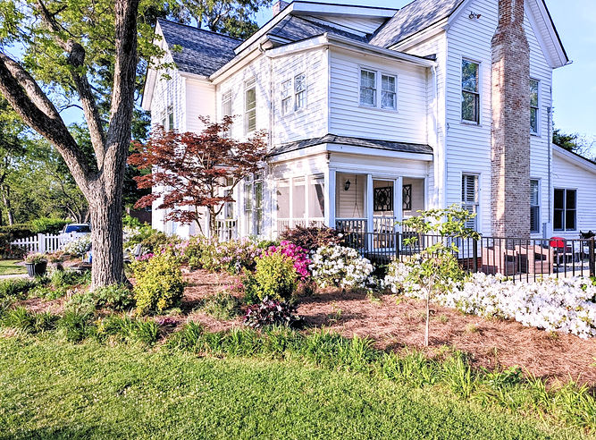 Front view of home with flowers