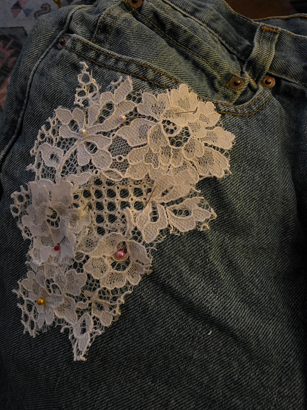 Lace pinned in place over the stain.