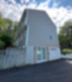 House exterior painting by Dirigo Paint Co. with attached garage