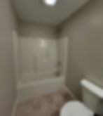 Freshly painted bathroom by Dirigo Paint Co. with tub and shower