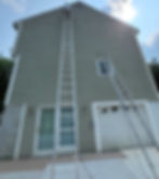 Exterior house painting in progress by Dirigo Paint Co.