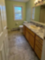 Bathroom painting by Dirigo Paint Co. with wood vanity and double sink