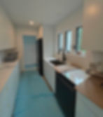 Kitchen painting by Dirigo Paint Co. with white walls and cabinetry