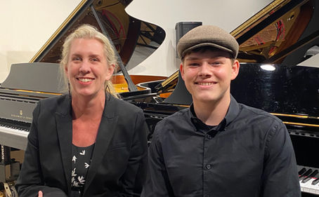 Piano teacher and student