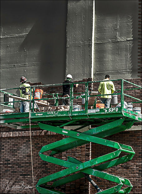 Crew bricking up building along Tampa Bay Harbor Tour, Tampa FL